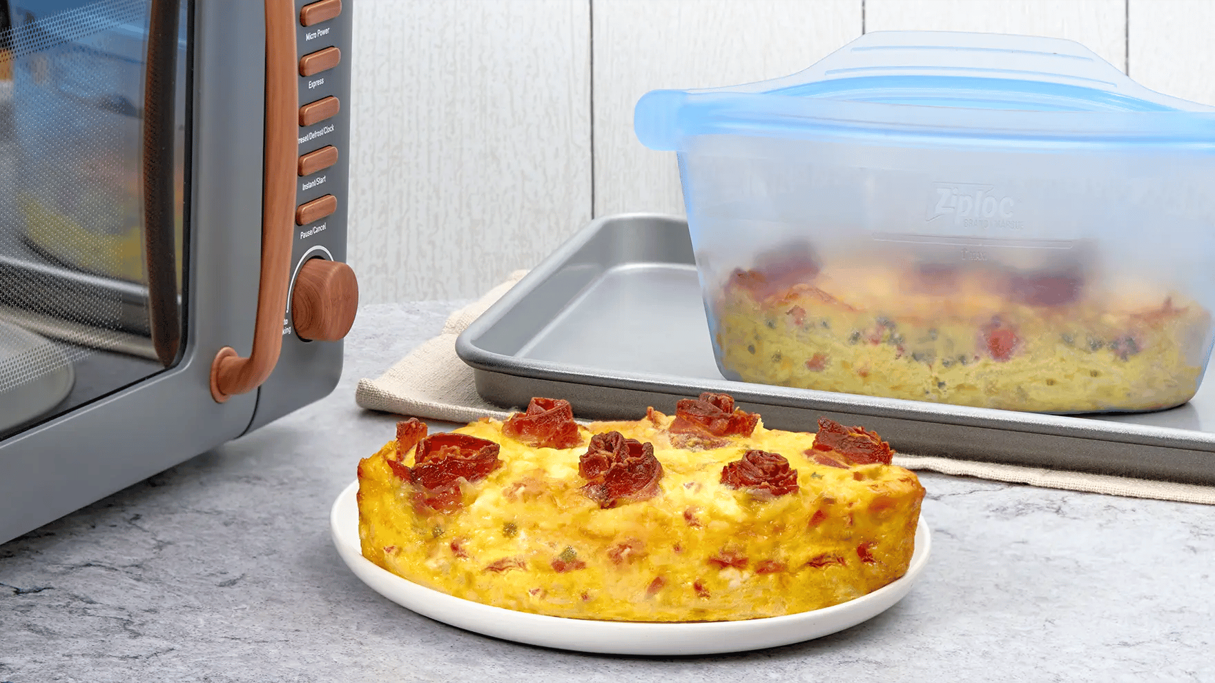 Golden breakfast casserole made with bacon, eggs and hashbrowns, served in a Ziploc® Endurables™ Container